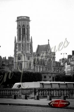 black and white image of notre dame cathedral paris france gargoyles seine