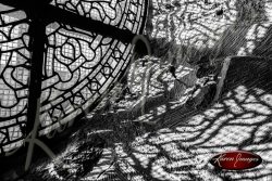 Black and white of brugge belgium reflections of a leaded glass window