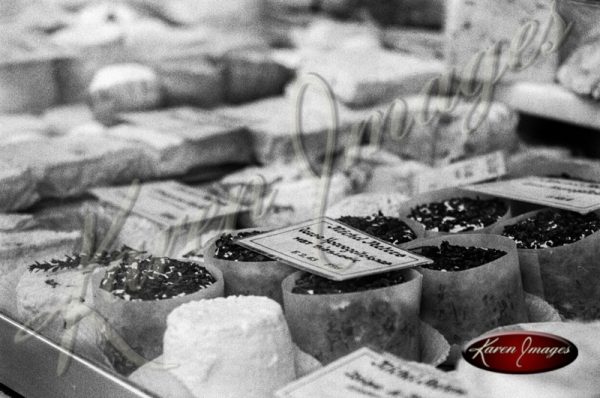 Black and white of cheese in a store window
