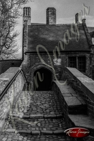 Black and white of brugge belgium ancient old brick bridge over canal